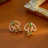 Hyacinth's niche design of high-end new bow earrings, stud earrings, versatile ear clips, and olive green zircon pearl tassel earrings details Picture